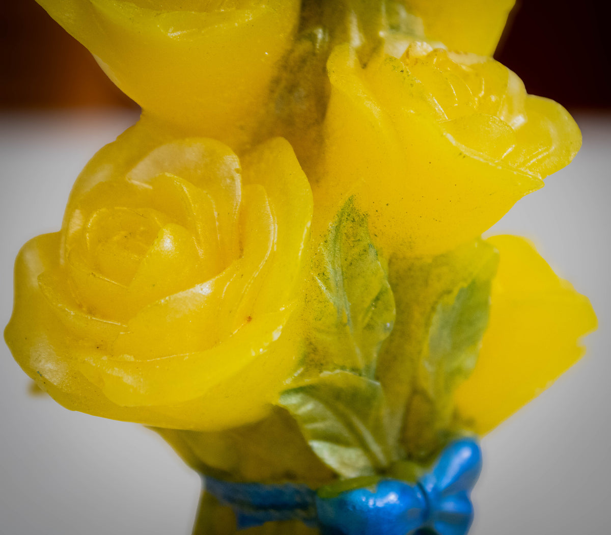 Sculptural Yellow Rose Bouquet Candle — Vibrant Blue Bow Accent