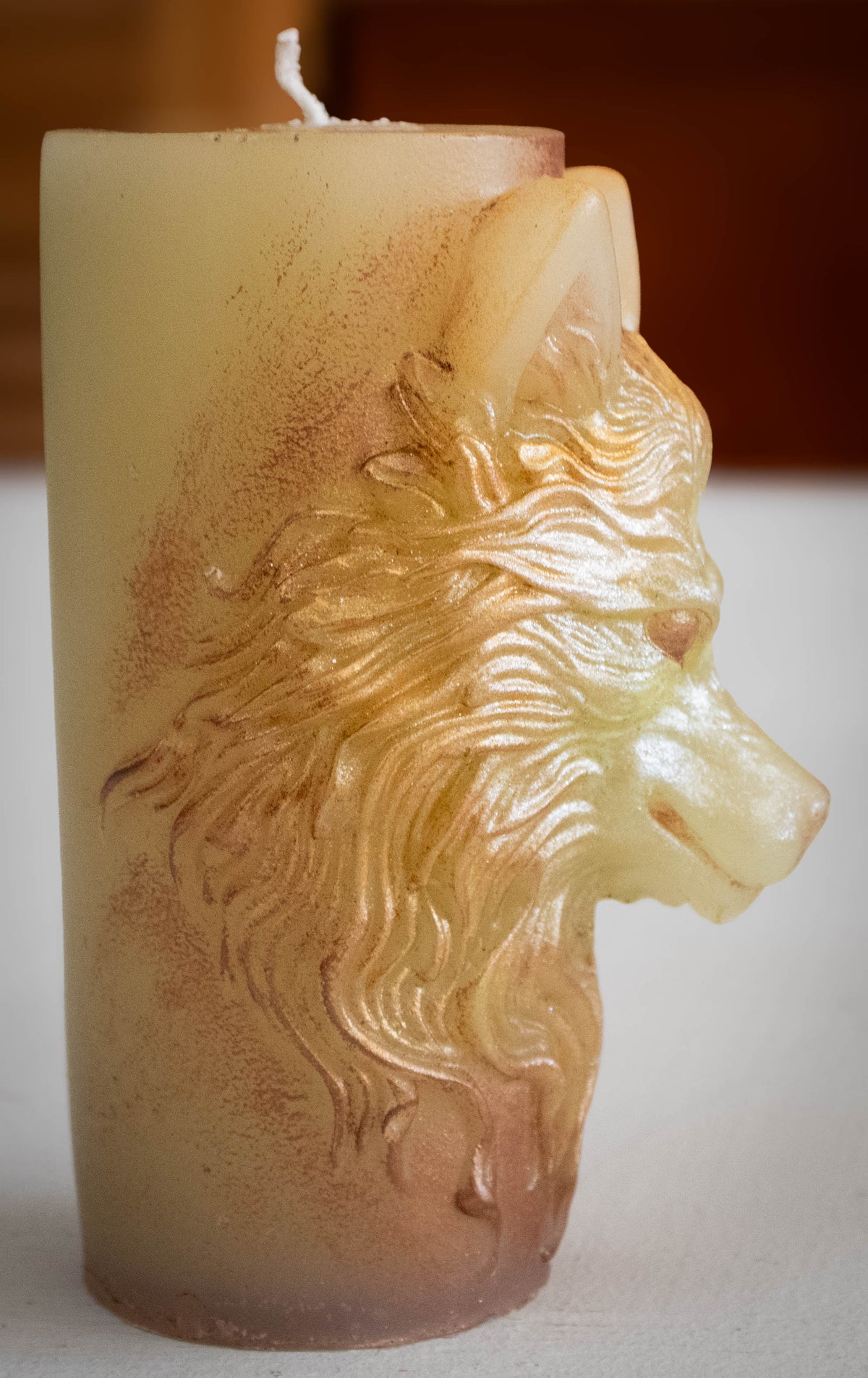 Embossed Wolf Head Pillar Candle — Frost & Bronze Accent